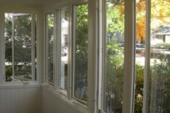 Interior enclosed porch with casement windows