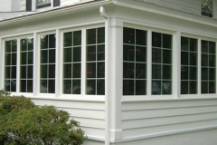 Outdoor porch enclosed with casement windows